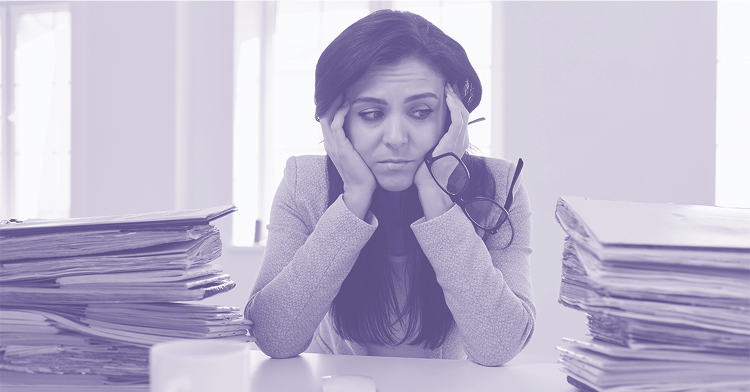 Frustrated senior living admin at the amount of paperwork from her communities move-in process