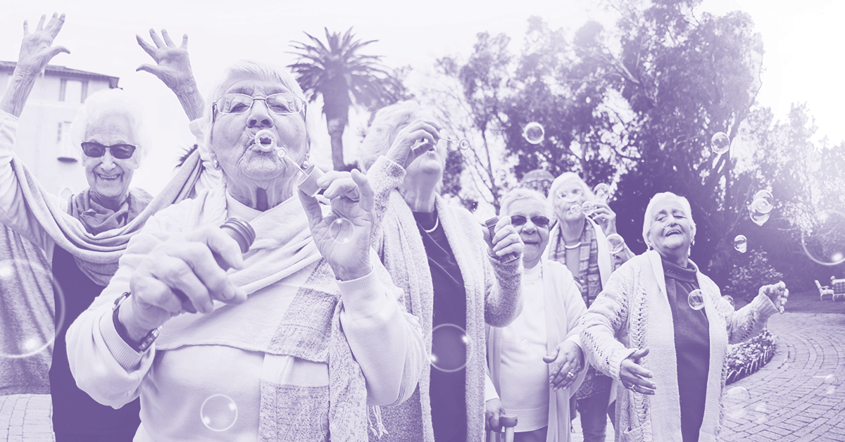 elderly blowing bubbles - top assisted living software 2025